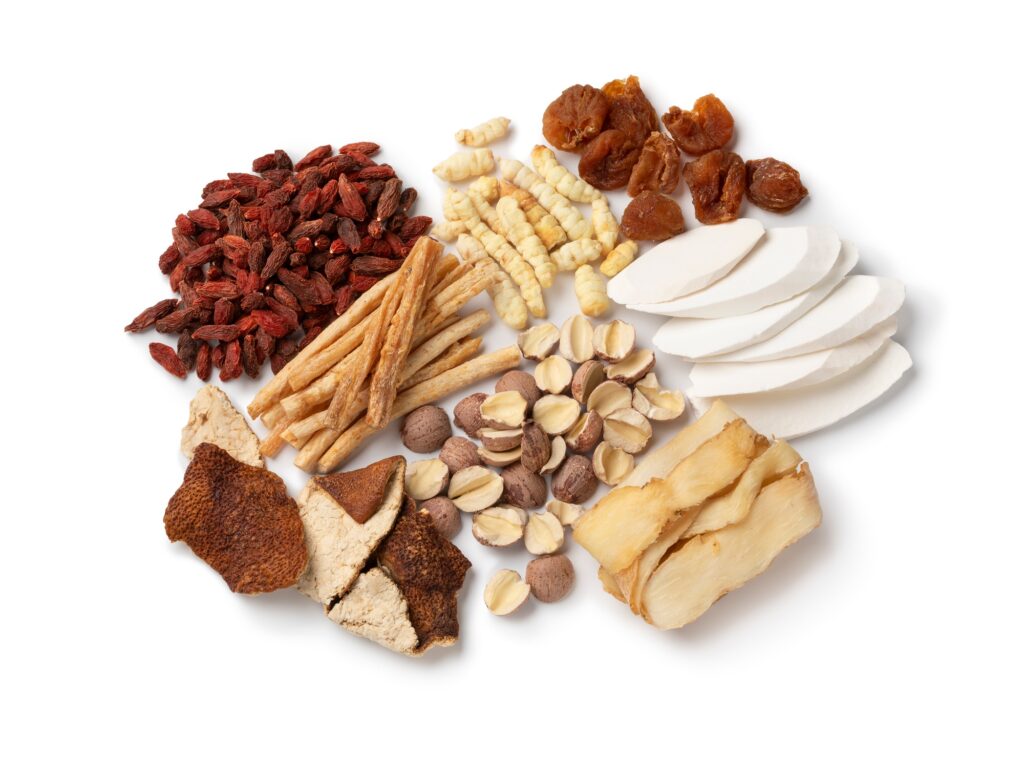 Group of Chinese dried herbs to make a healthy soup or bouillon on white background